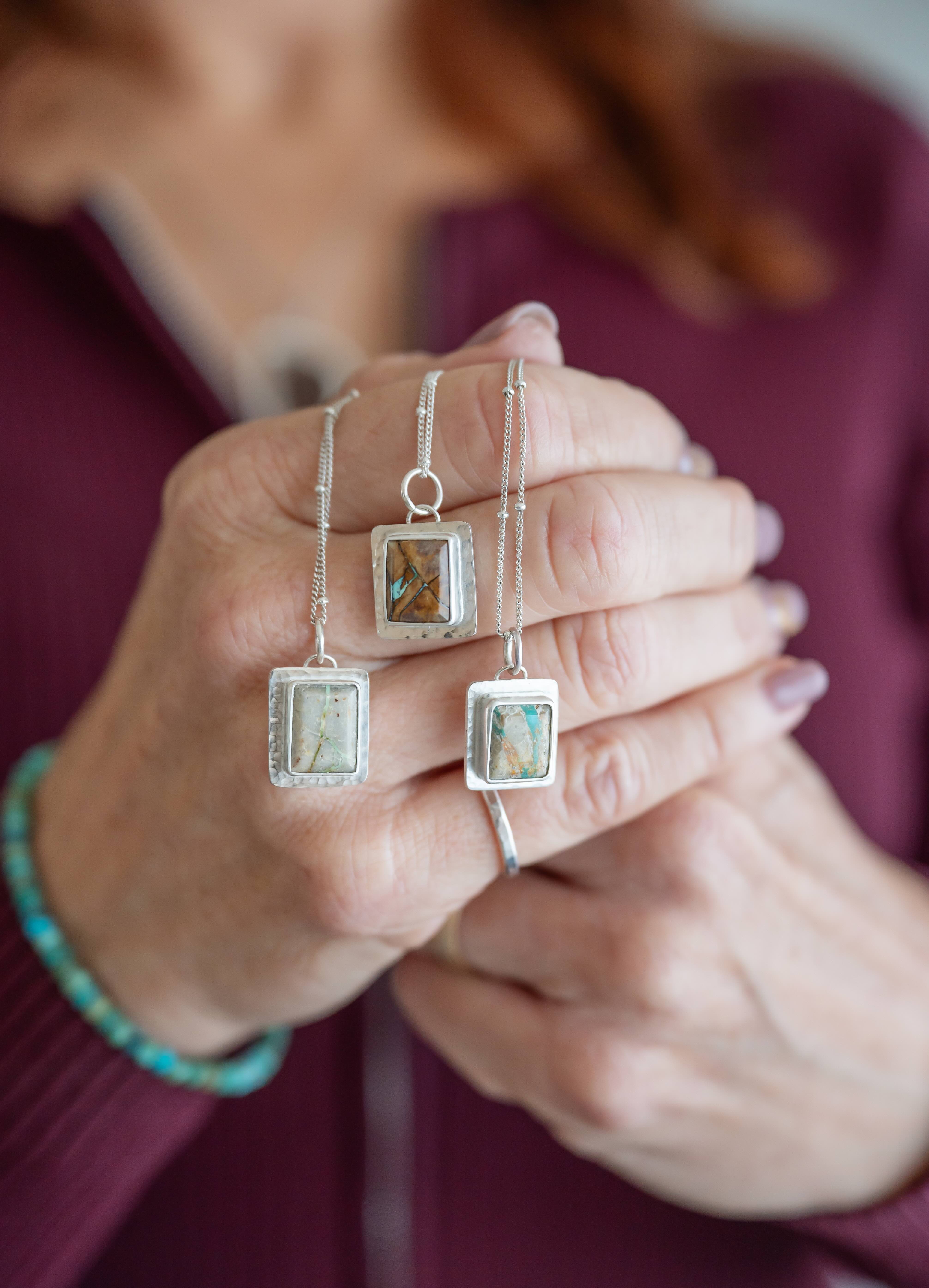 Turquoise beaded necklace with turquoise stone pendant. Set in sterling silver.