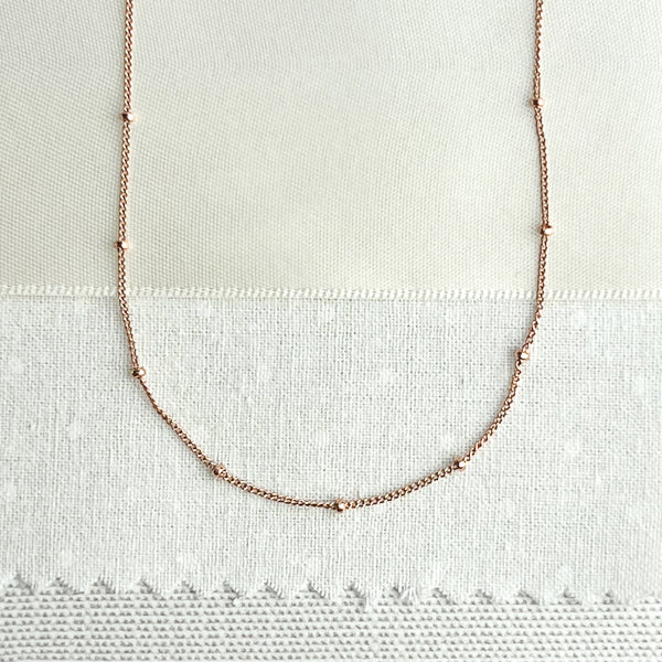 Rose gold-filled chain. Add a delicate touch of femininity to your look with this beautiful 14kt rose gold-filled choker/ layering necklace. The necklace measures 16 inches, perfect for layering with other necklaces or wearing it alone for a more minimalist look.