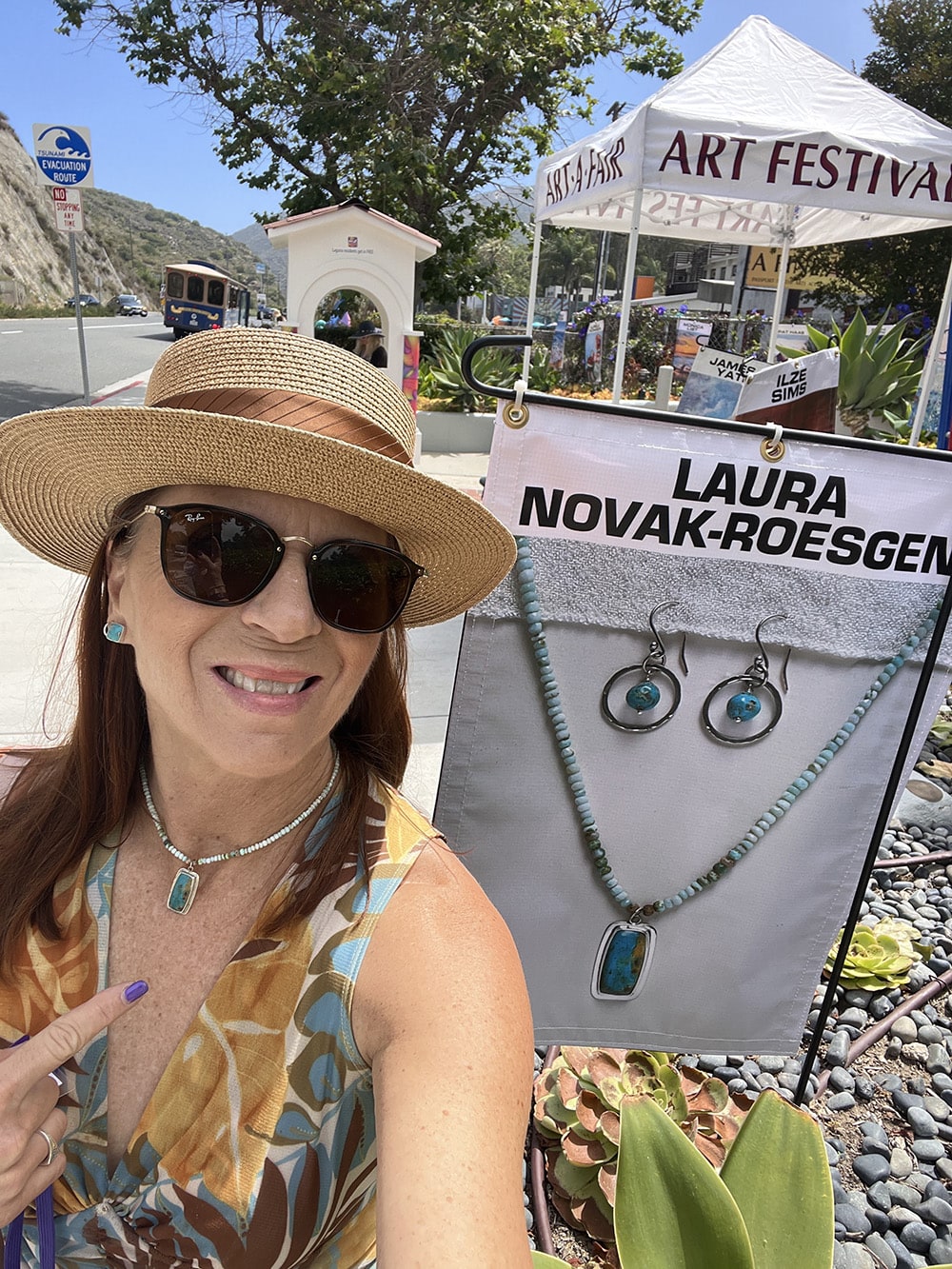 Novaura Jewelry sold at Laguna Art-A-Fair festival, featuring handcrafted turquoise and gemstone jewelry by Laura Novak-Roesgen