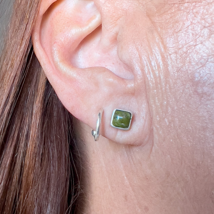 Sonoran Gold Turquoise and Sterling Silver Stud Earrings - Small Square. Worn on ear.