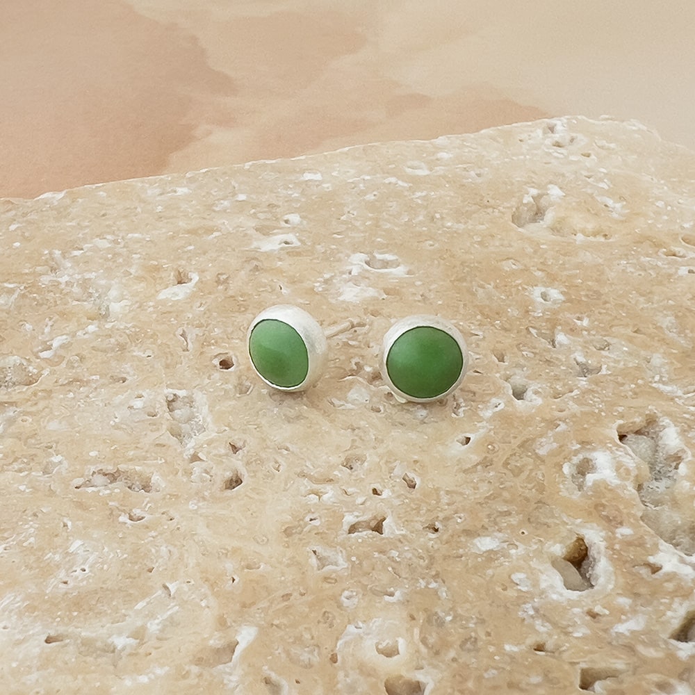 Small Turquoise and sterling silver round studs. Clear green color with no matrix.