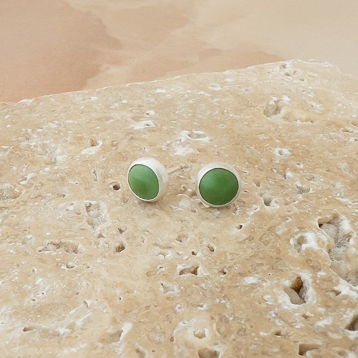 Small Turquoise and sterling silver round studs. Clear green color with no matrix.