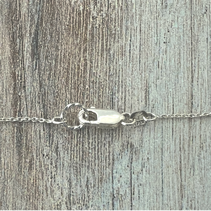 Detail of the sterling silver lobster clasp closure.