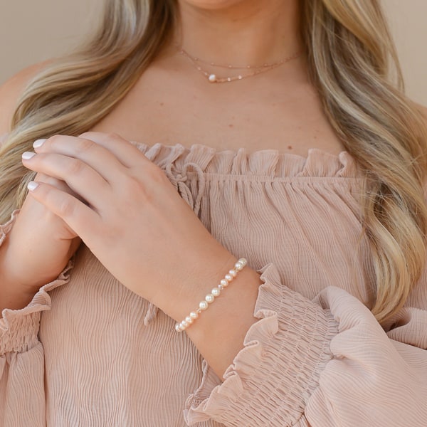 Jessica wearing the Freshwater & Crystal Pearl Bracelet with the Luminous Rose Necklace