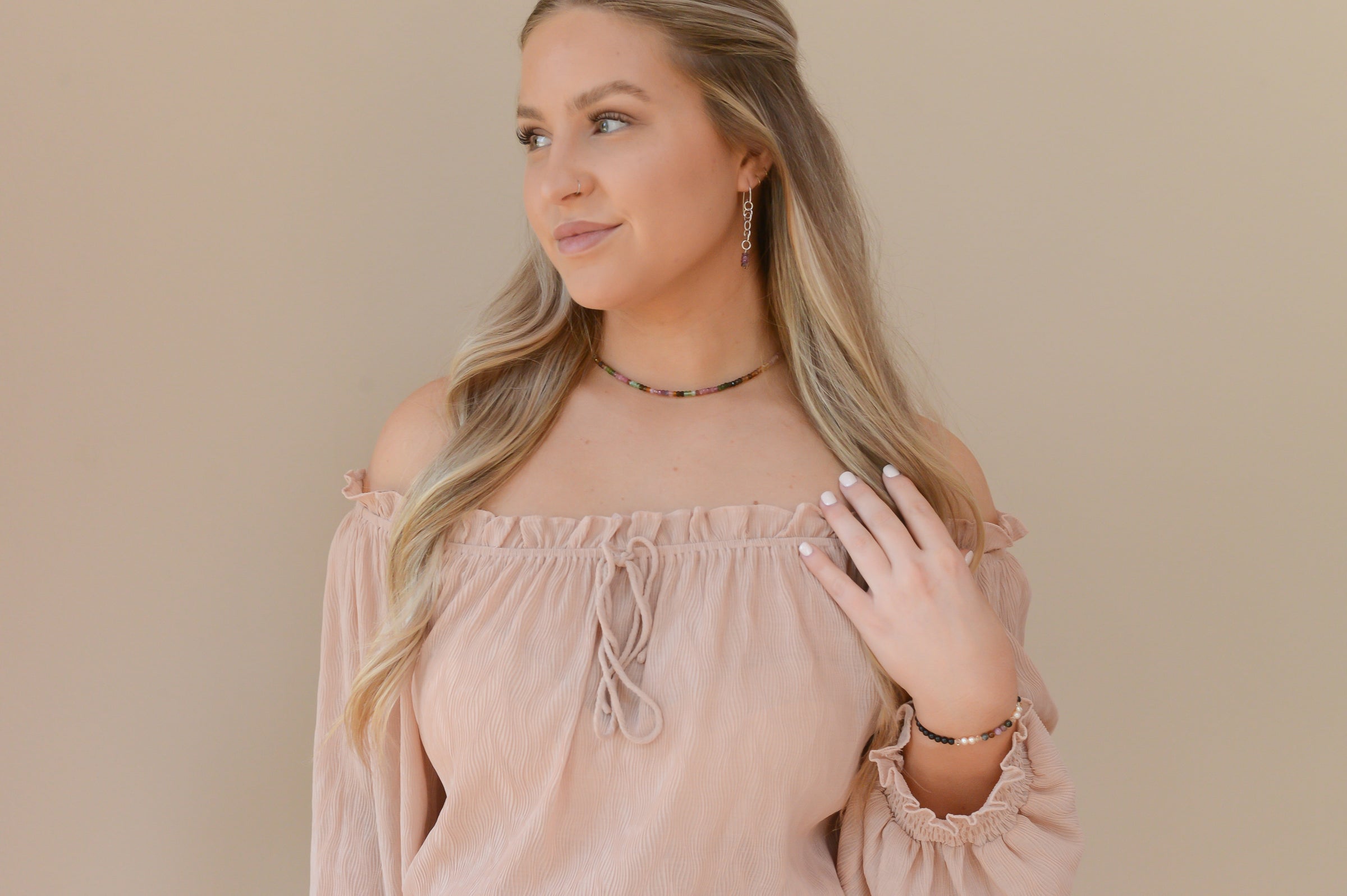 Jessica wearing the Tourmaline Sparkle Choker and Pink Tourmaline and sterling silver dangle earrings. Complete the look with a tourmaline and pearl bracelet.