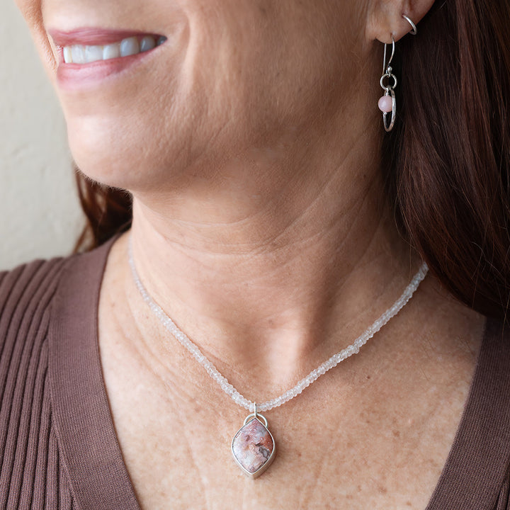 Explore the enchanting beauty of our Laguna Lace Agate and Rose Quartz Necklace. The exquisite Laguna Lace Agate stone showcases intricate details, rendering each necklace truly unique.