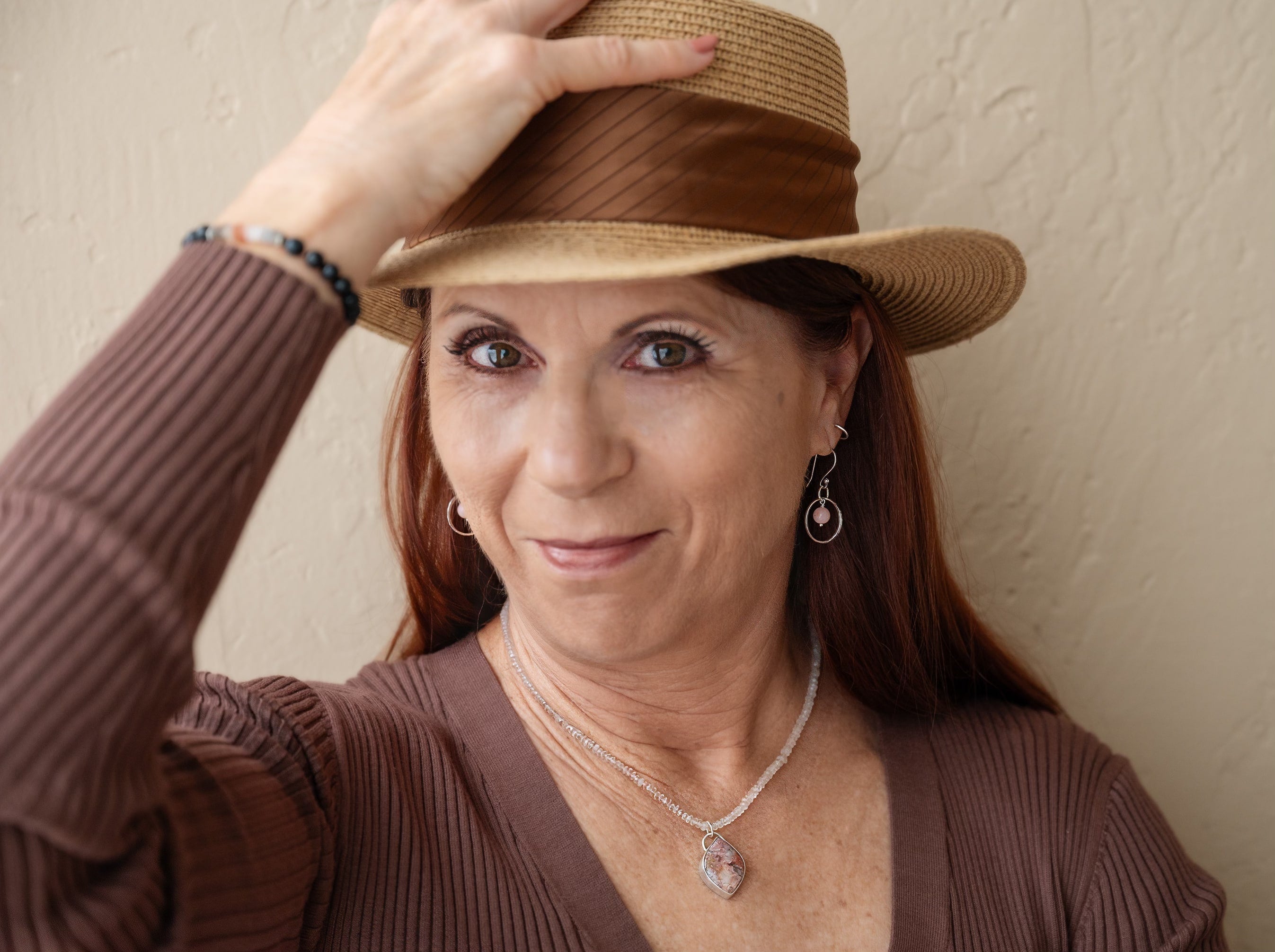 Laura Novak-Roesgen, jewelry artist and founder of Novaura Jewelry, creating handcrafted turquoise and gemstone pieces in Southern California