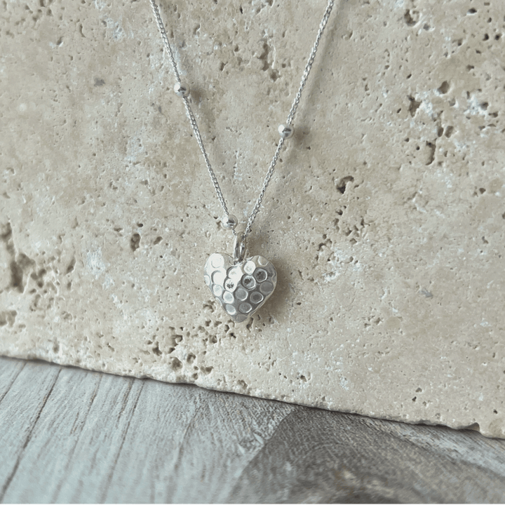 Fine silver heart necklace reveals the romantic & soft side of her personality. Looks lovely with all her sterling silver earrings. Simple and Beautiful Elegance.