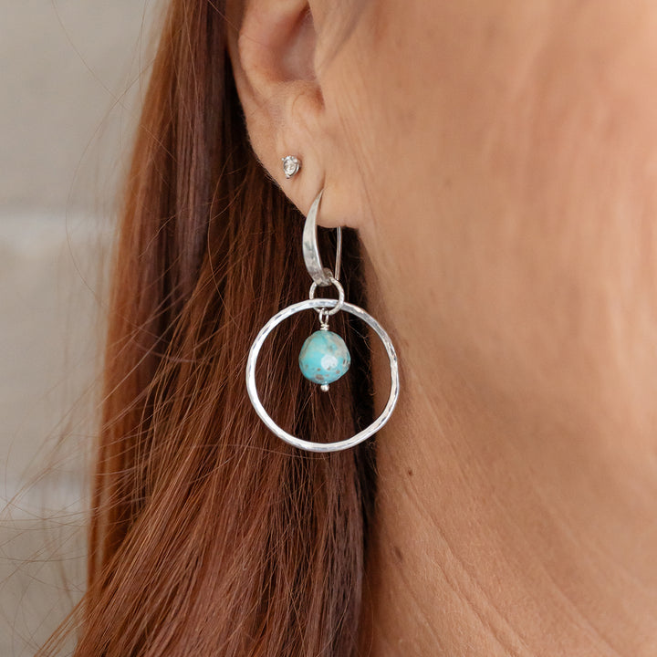 Enhance your outfit with these exquisitely designed medium hoops, crafted with sterling silver and adorned with natural Sonora Turquoise Nugget Beads.