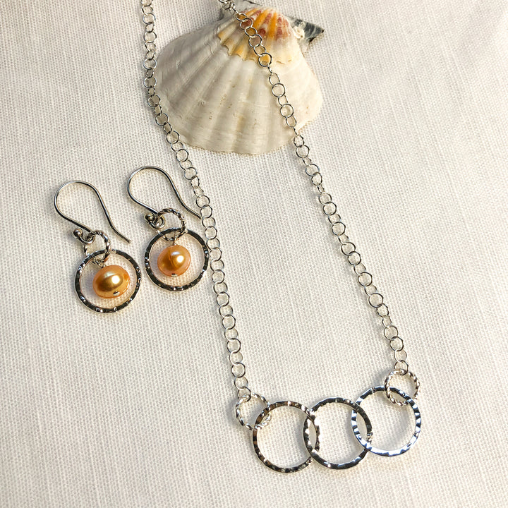 Fresh as summer- Apricot Pearl & Silver-plated 14mm hammered silver circles. Lightweight and graceful. Shown with 3-circle Hammered Round Silver Necklace (Sold separately)