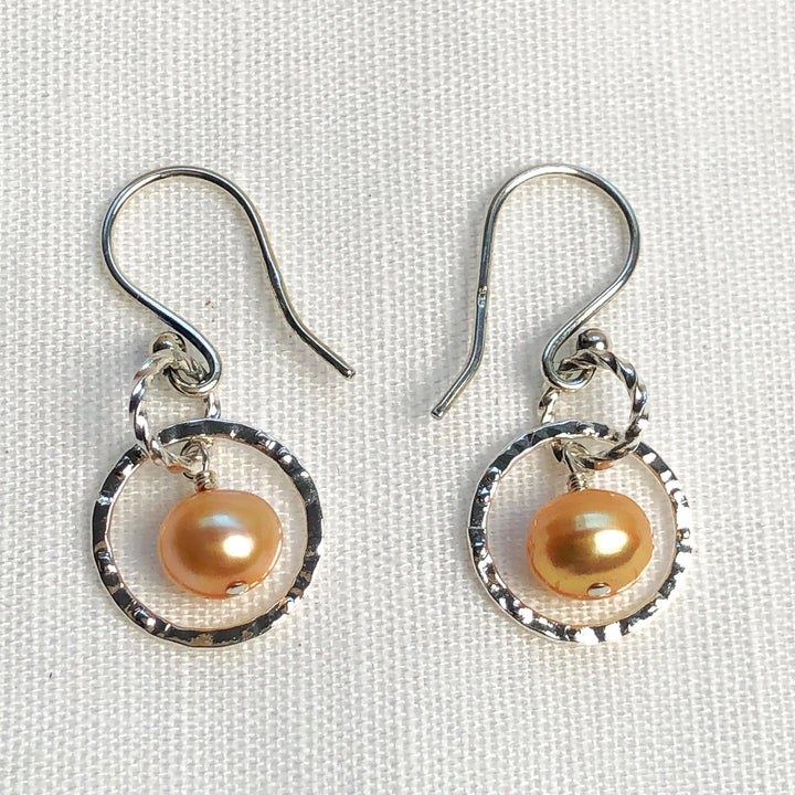 Fresh as summer- Apricot Pearl & Silver-plated 14mm hammered silver circles. Lightweight and graceful. Handcrafted in California. Sold as part of the Novaura Sparkle Set. Handcrafted in California.