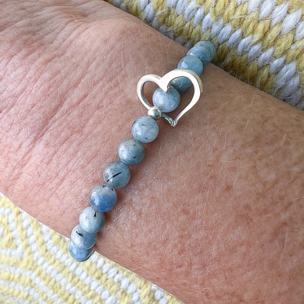 Ocean's Heart bracelet shown on wrist.