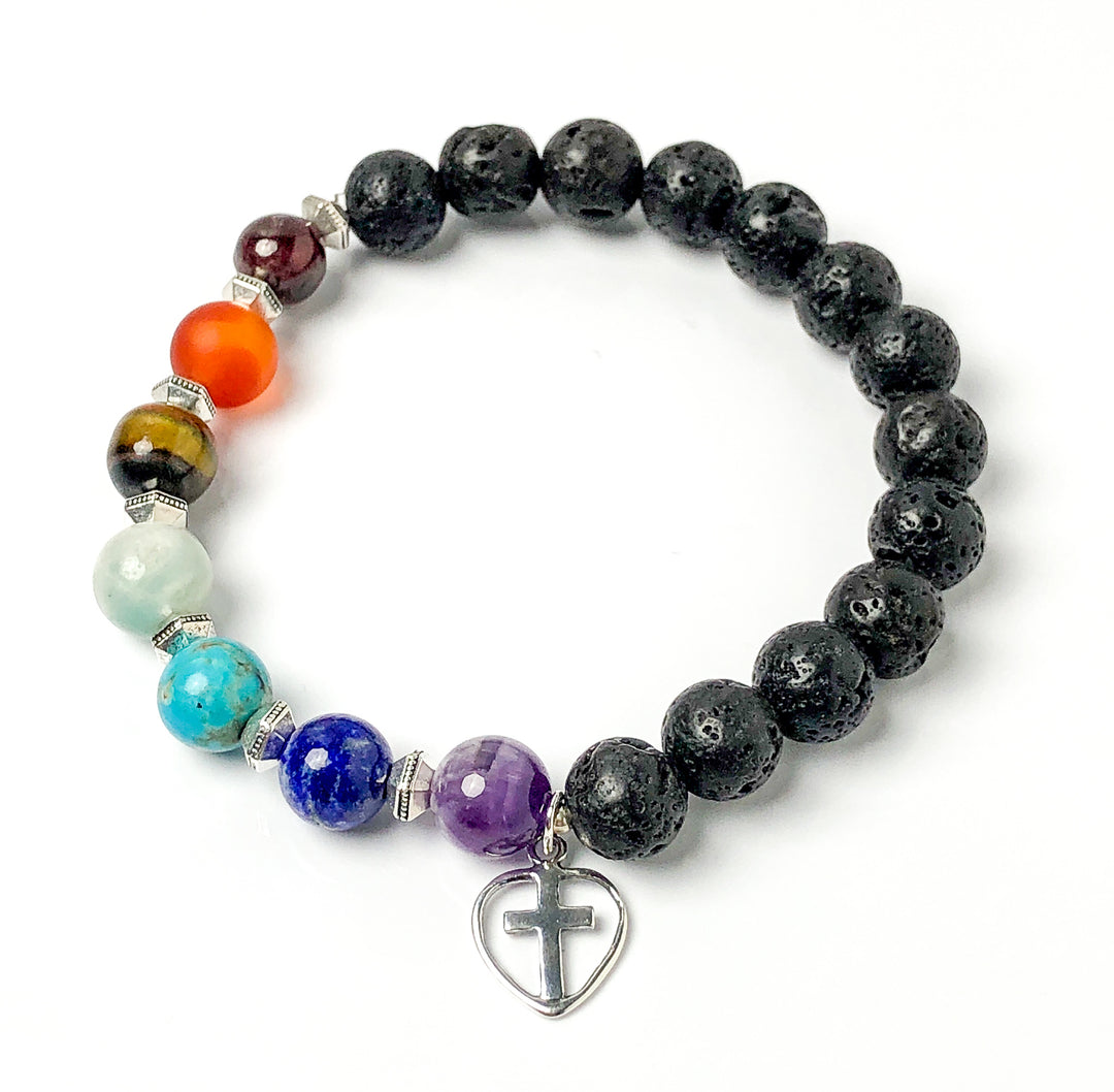 Semi-precious Gemstone 7 Chakra Bracelet, Sterling Silver Open Heart with Cross Charm, Lava Stone Bracelet, 8mm Beads, Handcrafted in CA.  This soul-inspired Chakra bracelet is handcrafted with 8mm lava & gemstone beads, Sterling Silver open heart cross charm, and antique silver-plated pewter spacers. Top view