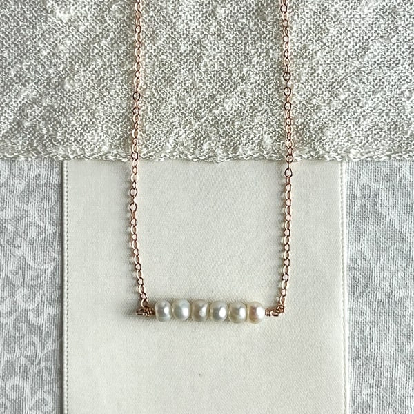 Dainty Pearl necklace for a special occasion or wedding.  Versatile to wear with a simple pair of pearl earrings; Handcrafted in California. Close up of Pearls