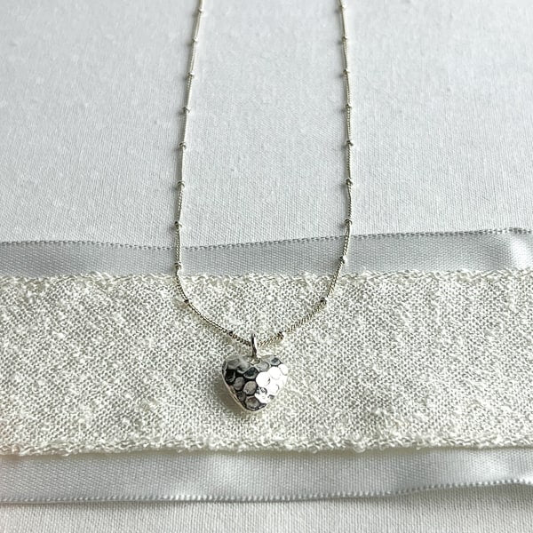 Fine silver heart necklace reveals the romantic & soft side of her personality. Looks lovely with all her sterling silver earrings. Simple and Beautiful Elegance.