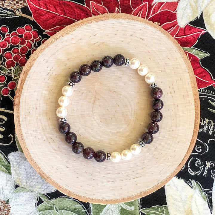 Semi-precious Garnet & Cream Rose Crystal Pearls in a lovely stretch bracelet to compliment your holiday wardrobe.  Handcrafted in CA.