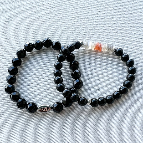 Love and Strength Onyx Bracelet shown with Novaura Jewelry Lunar Shield bracelet..