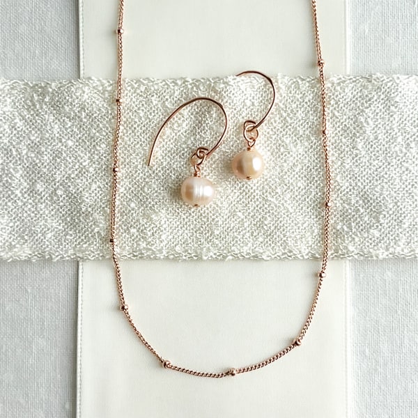 Delicate layering necklace in 14kt Rose Gold Filled; 16 inches. Shown with pearl earrings