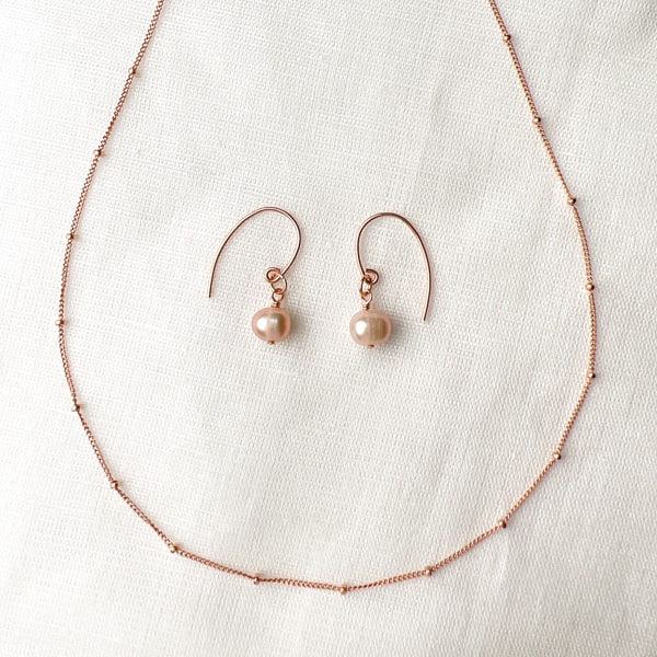 Cultured Freshwater Pearl & 14KT Rose-Gold Filled Earrings; Versatile to wear with a simple chain or a freshwater pearl necklace; Shown with Rose Gold Choker - not included.