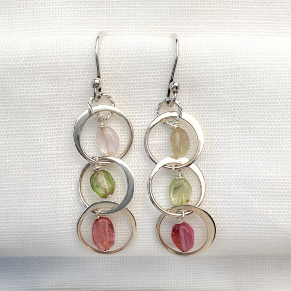 Tourmaline Chandelier Earrings. The translucent clear pink and green gems cascade beautifully in a chandelier style for a piece of wearable art. A very lightweight style that won't drag you down. Simple and Beautiful Elegance.