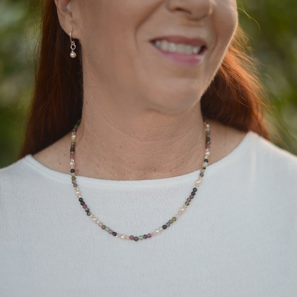 Are you a Pearl or a Gemstone gal? Have both with this Tourmaline and Pearl necklace. Wear to your next wedding event, date night with your partner, or business conference. You will turn heads with this stunner. Worn with Pearl silver earrings - not included.