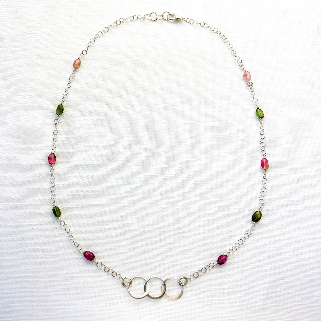 Discover the natural radiance and rainbow of colors of this tantalizing gemstone. Effortlessly go from classic “work mode” looks to lightweight weekend layers. The translucent pink and green gems match evenly from side to side for a beautifully balanced piece of wearable art. Simple and Beautiful Elegance.