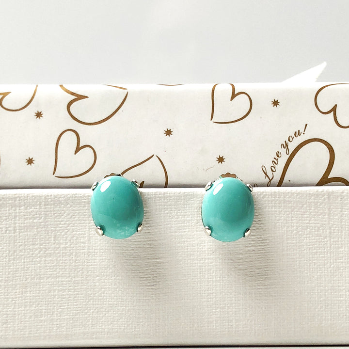 TURQUOISE-- get drawn by its beauty and its positivity - the translucent blue pop of color that makes you feel calm, relaxed, and happy. Simple stud earrings to wear alone or with your favorite sterling necklace.